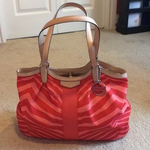 Coach bag NWT (price removed). Hot Orange/Tan.